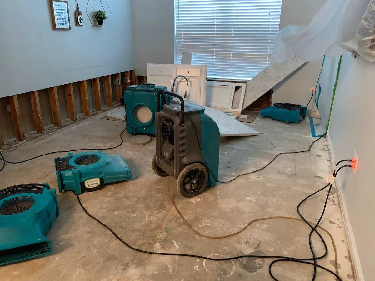 Dehumidifier in flood-cut room for Water Damage Restoration in Putnam